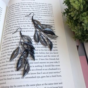 Silver feather dangle earrings